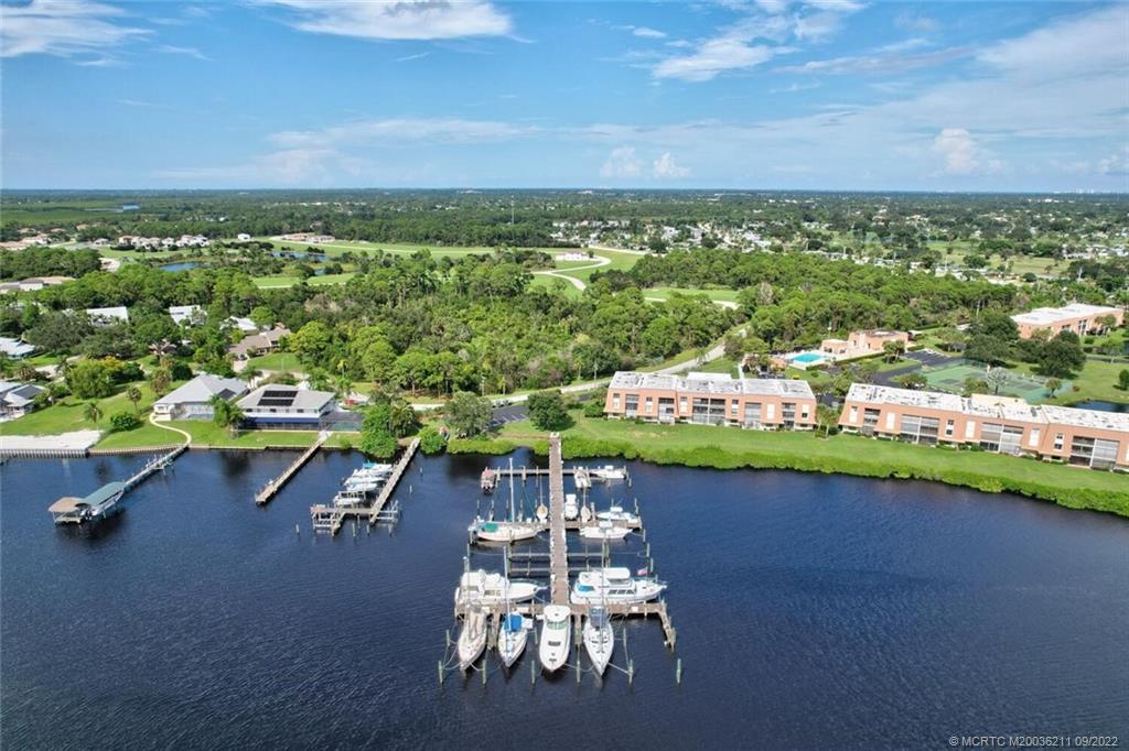 3100 Southeast Pruitt Road, Unit B102 Port St. Lucie, FL 34952 - Photo 2 of 55 a view of a city with lawn chairs