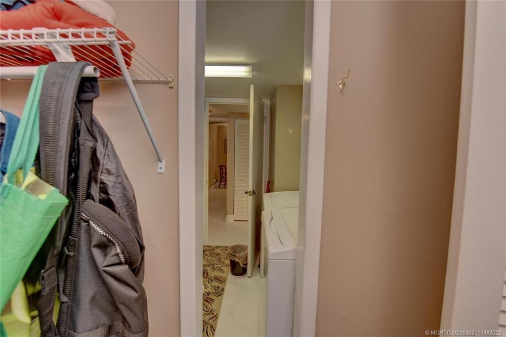 3100 Southeast Pruitt Road, Unit B102 Port St. Lucie, FL 34952 - Photo 30 of 55 a view of walk in closet with clothes and shoes