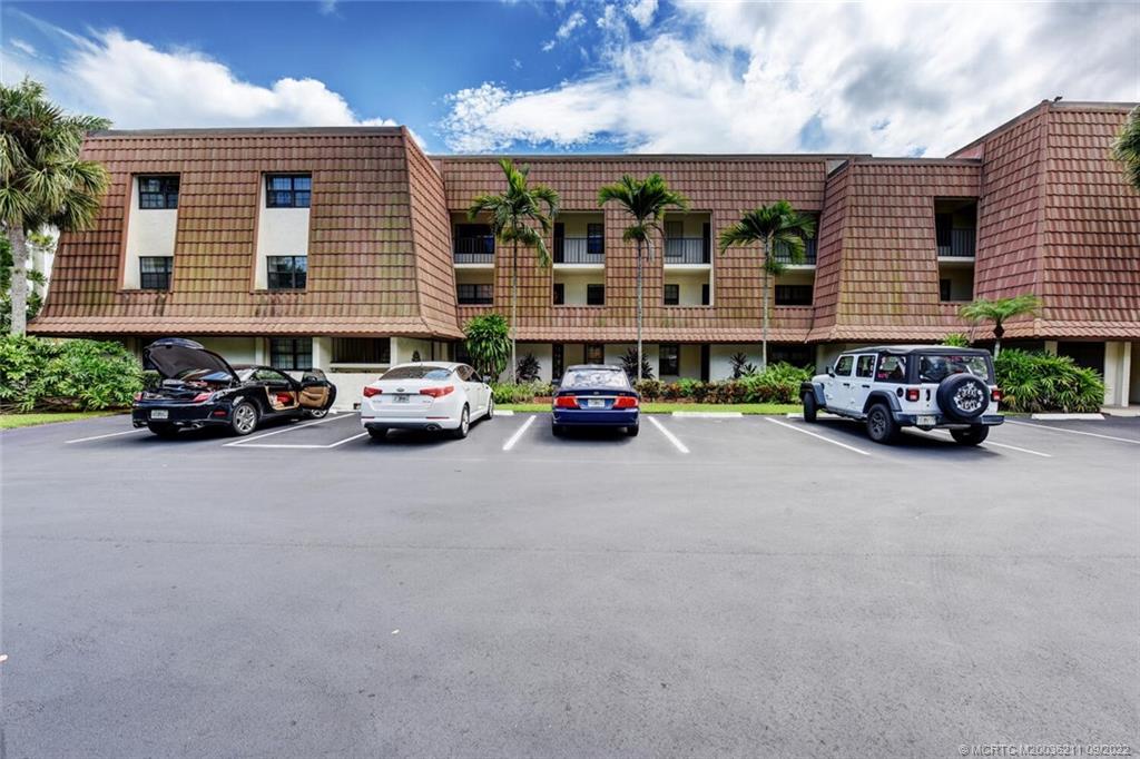 3100 Southeast Pruitt Road, Unit B102 Port St. Lucie, FL 34952 - Photo 3 of 55 a car parked in front of a building