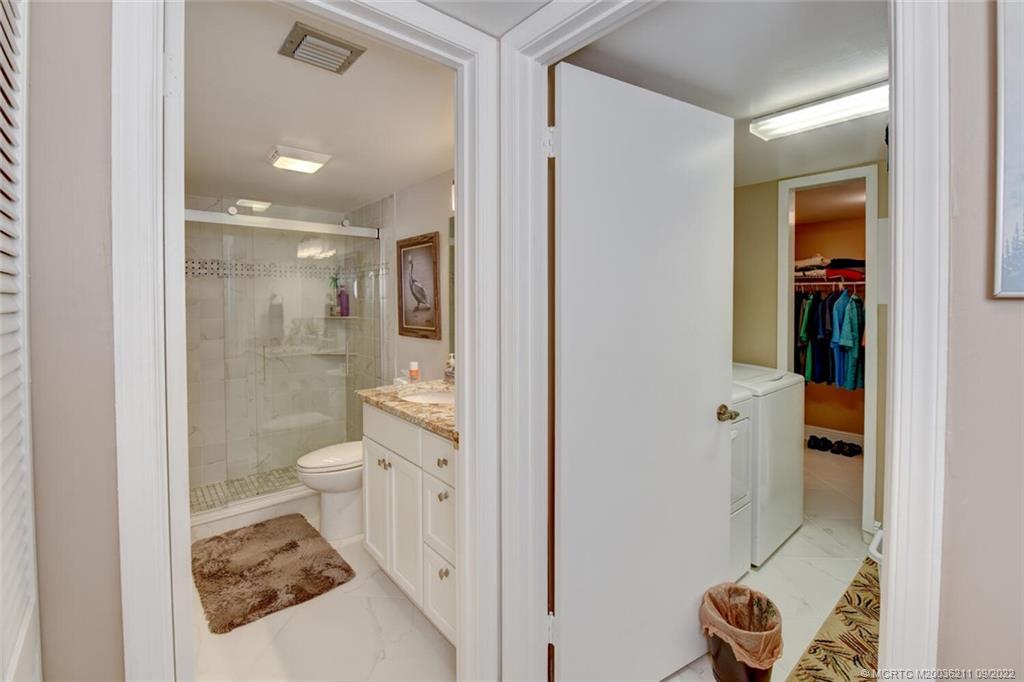 3100 Southeast Pruitt Road, Unit B102 Port St. Lucie, FL 34952 - Photo 33 of 55 a bathroom with a toilet and a shower
