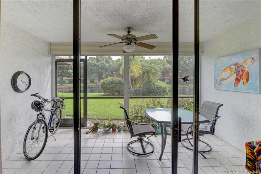 3100 Southeast Pruitt Road, Unit B102 Port St. Lucie, FL 34952 - Photo 37 of 55 a view of a livingroom with furniture water swimming pool and furniture