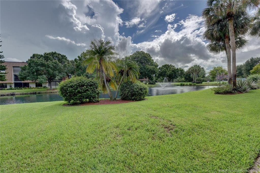3100 Southeast Pruitt Road, Unit B102 Port St. Lucie, FL 34952 - Photo 38 of 55 a view of a garden and basketball court