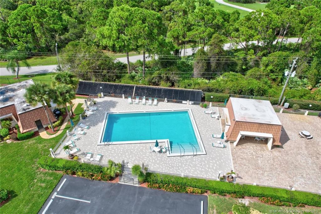 3100 Southeast Pruitt Road, Unit B102 Port St. Lucie, FL 34952 - Photo 46 of 55 an aerial view of a house with swimming pool garden and patio