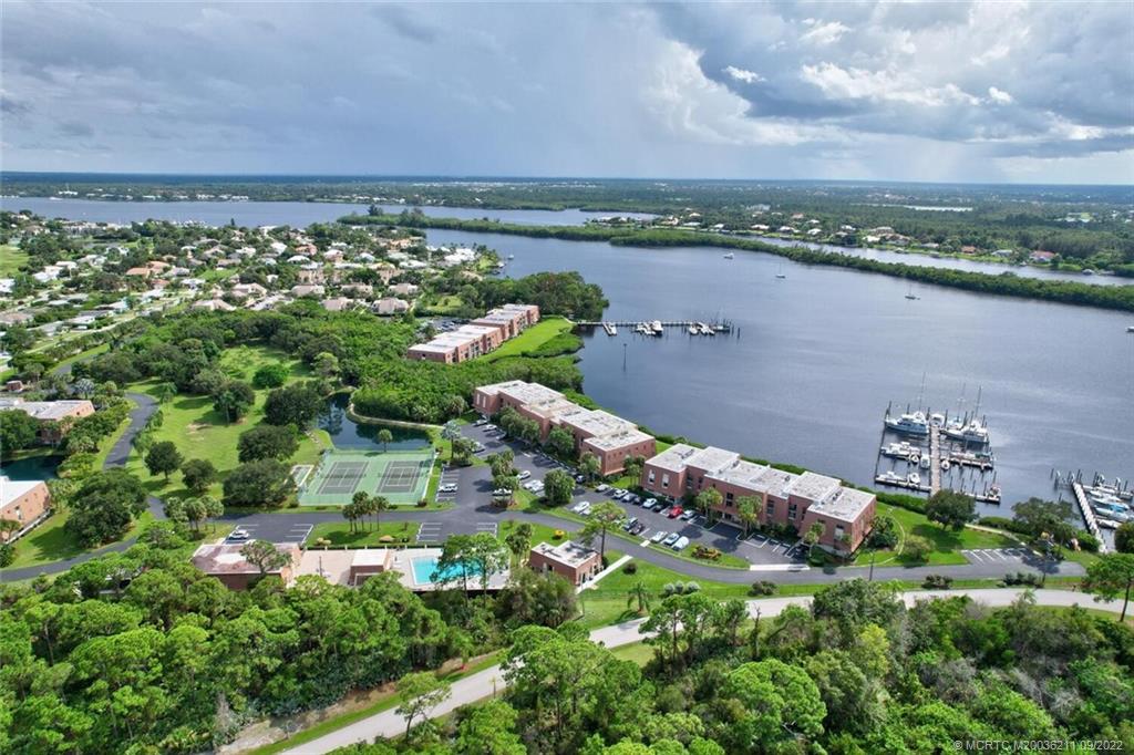 3100 Southeast Pruitt Road, Unit B102 Port St. Lucie, FL 34952 - Photo 50 of 55 an aerial view of a houses with a yard