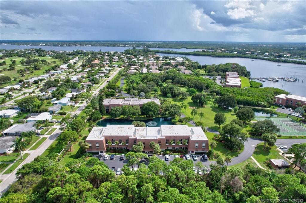 3100 Southeast Pruitt Road, Unit B102 Port St. Lucie, FL 34952 - Photo 52 of 55 an aerial view of a house with a garden