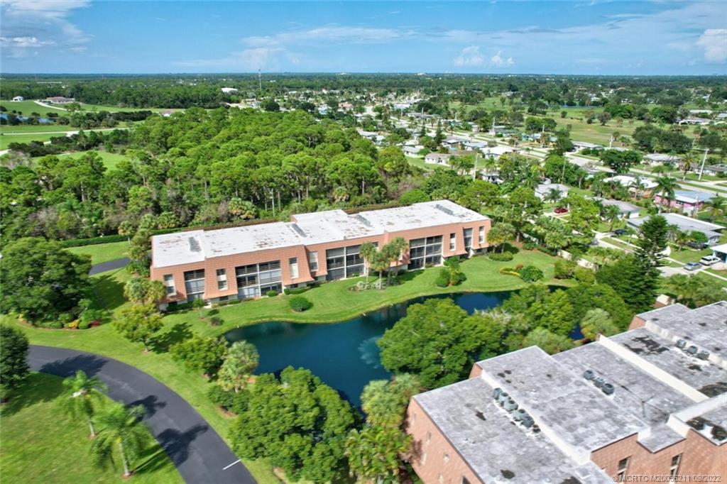 3100 Southeast Pruitt Road, Unit B102 Port St. Lucie, FL 34952 - Photo 55 of 55 an aerial view of a house with a garden