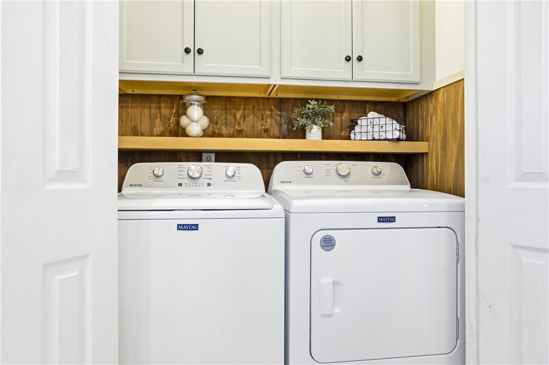 401 Colley Lane St. Simons Island, GA 31522 - Photo 10 of 27 Laundry with Cabinet Storage