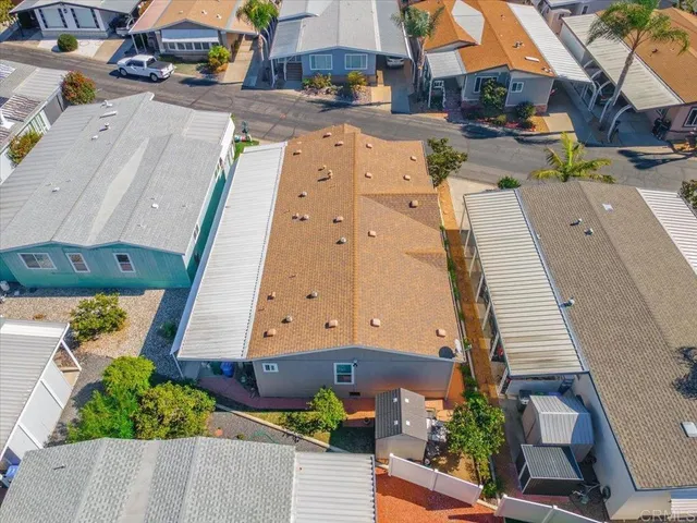 an aerial view of a house yard swimming pool and outdoor seating