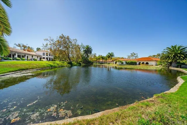 a view of a garden with a building in the background