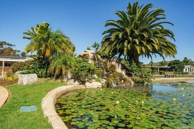 a view of a swimming pool with a lake view