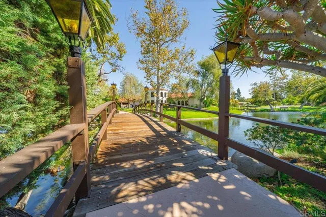 a view of a porch with furniture and a yard