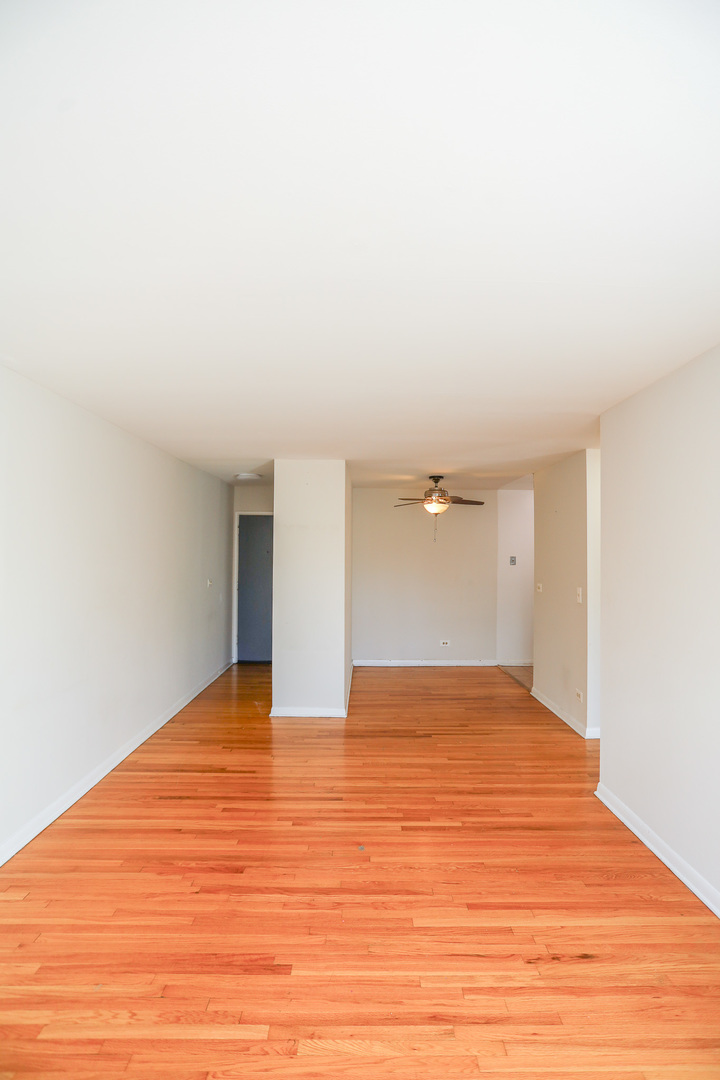 606 West Cornelia Avenue, Unit 482 Chicago, IL 60657 - Photo 4 of 13 a view of empty room with wooden floor