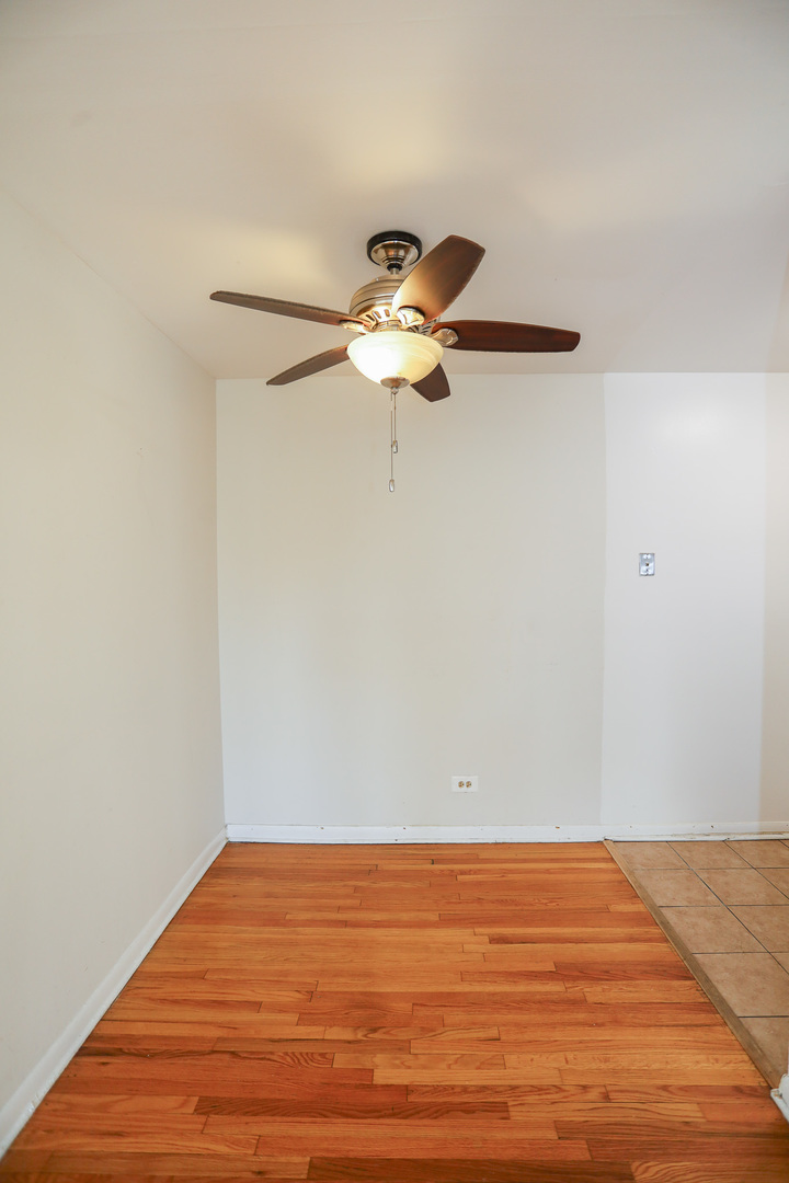 606 West Cornelia Avenue, Unit 482 Chicago, IL 60657 - Photo 7 of 13 a view of a room with wooden floor