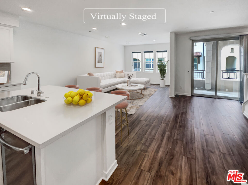 402 Echo Blue Lake Forest, CA 92610 - Photo 2 of 18 a view of a kitchen and dining room with wooden floor