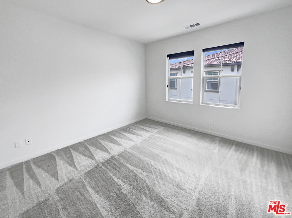 402 Echo Blue Lake Forest, CA 92610 - Photo 5 of 18 a view of an empty room with a window