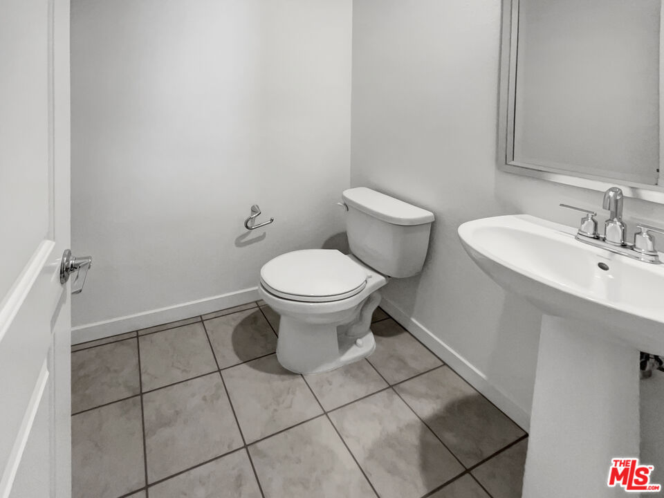 402 Echo Blue Lake Forest, CA 92610 - Photo 8 of 18 a bathroom with a toilet and a sink