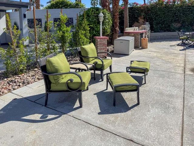 a view of a backyard with sitting area