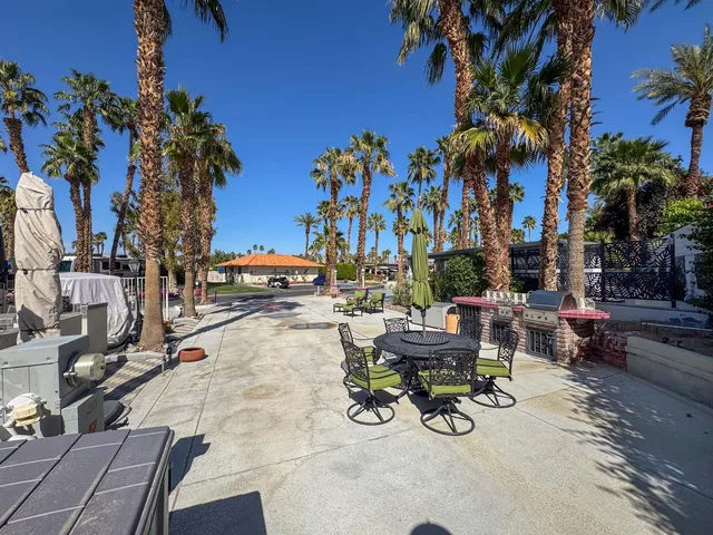 a view of a backyard with sitting area