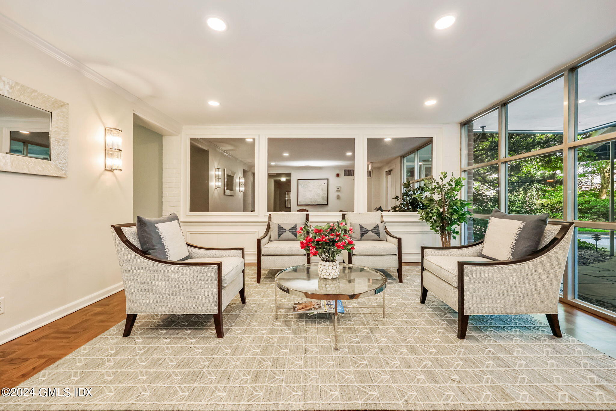 630 Steamboat Road, Unit 3CN Greenwich, CT 06830 - Photo 2 of 19 a living room with furniture and a potted plant