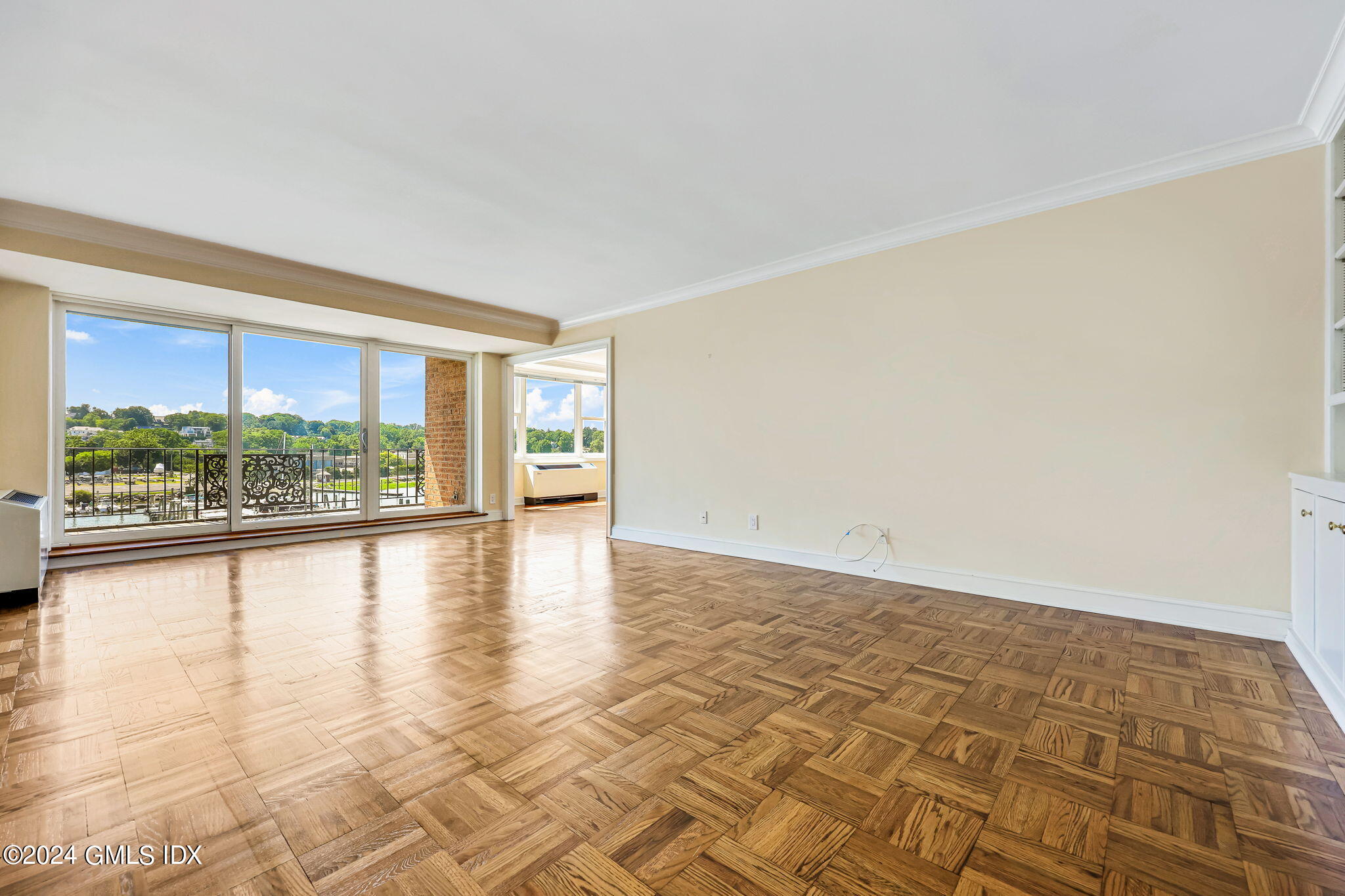 630 Steamboat Road, Unit 3CN Greenwich, CT 06830 - Photo 4 of 19 an empty room with large windows