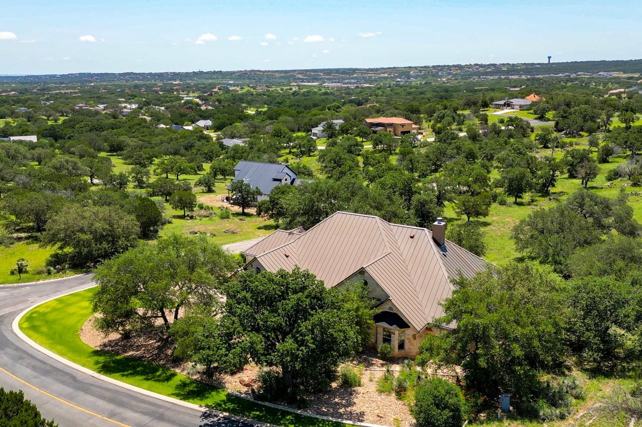 1612 Swear Injun Horseshoe Bay, TX 78657 - Photo 1 of 30 an aerial view of residential houses with outdoor space and trees
