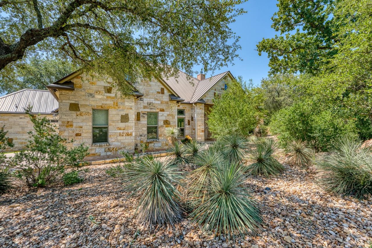 1612 Swear Injun Horseshoe Bay, TX 78657 - Photo 2 of 30 a view of a yard in front of house