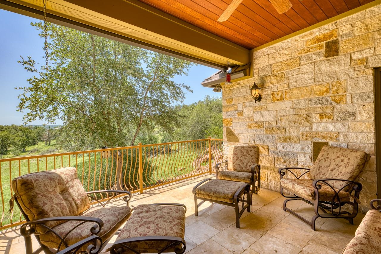 1612 Swear Injun Horseshoe Bay, TX 78657 - Photo 23 of 30 a balcony with couple of chairs and a couch