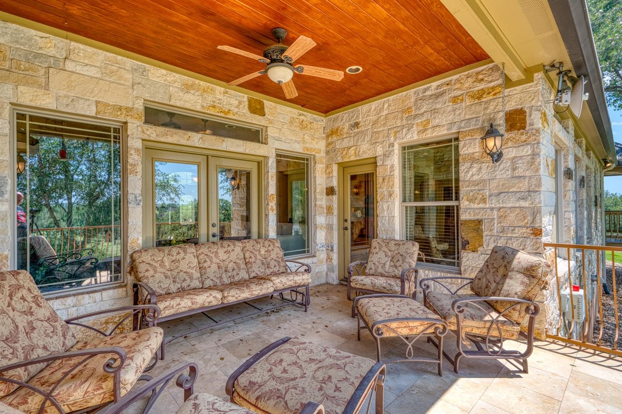 1612 Swear Injun Horseshoe Bay, TX 78657 - Photo 24 of 30 a living room with furniture and a large window