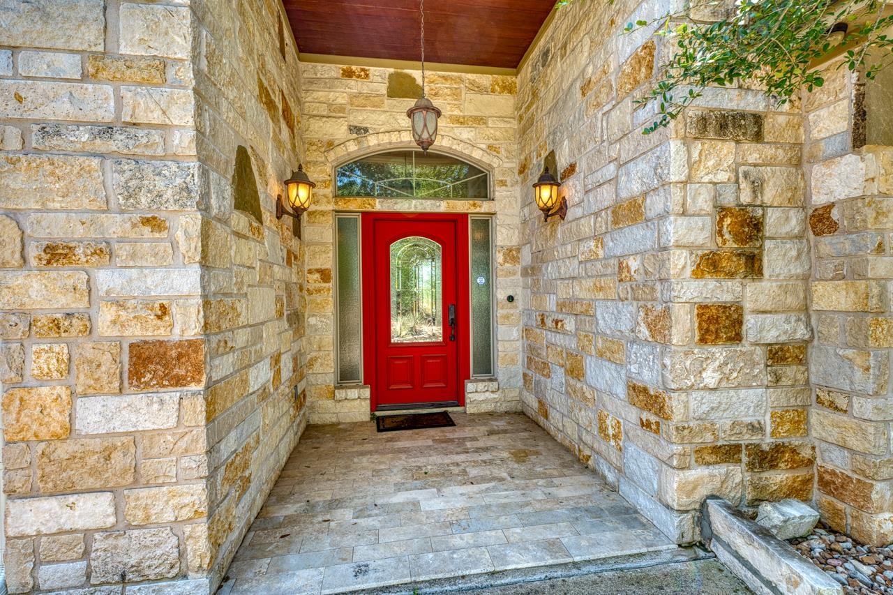 1612 Swear Injun Horseshoe Bay, TX 78657 - Photo 4 of 30 a door with brick wall