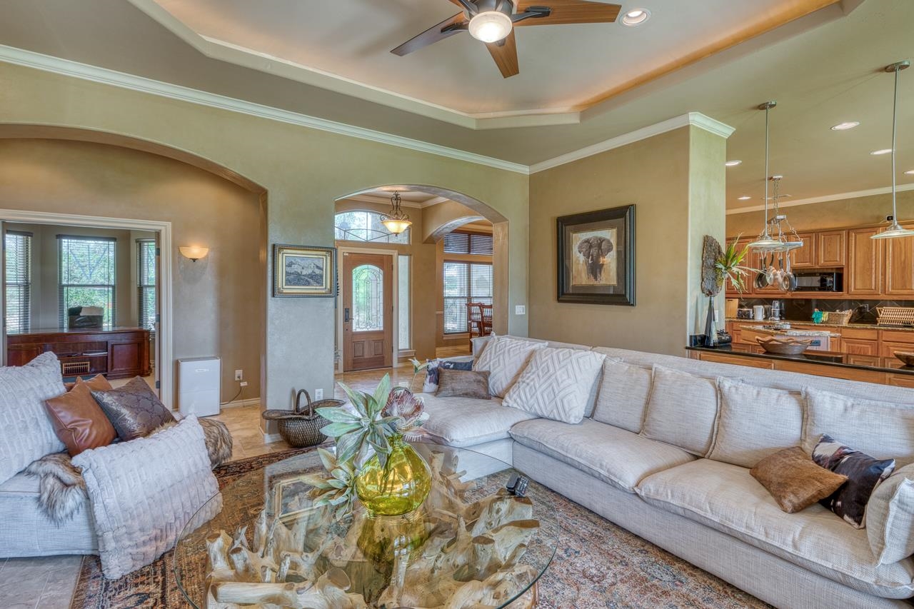 1612 Swear Injun Horseshoe Bay, TX 78657 - Photo 8 of 30 a living room with furniture ceiling fan and a rug
