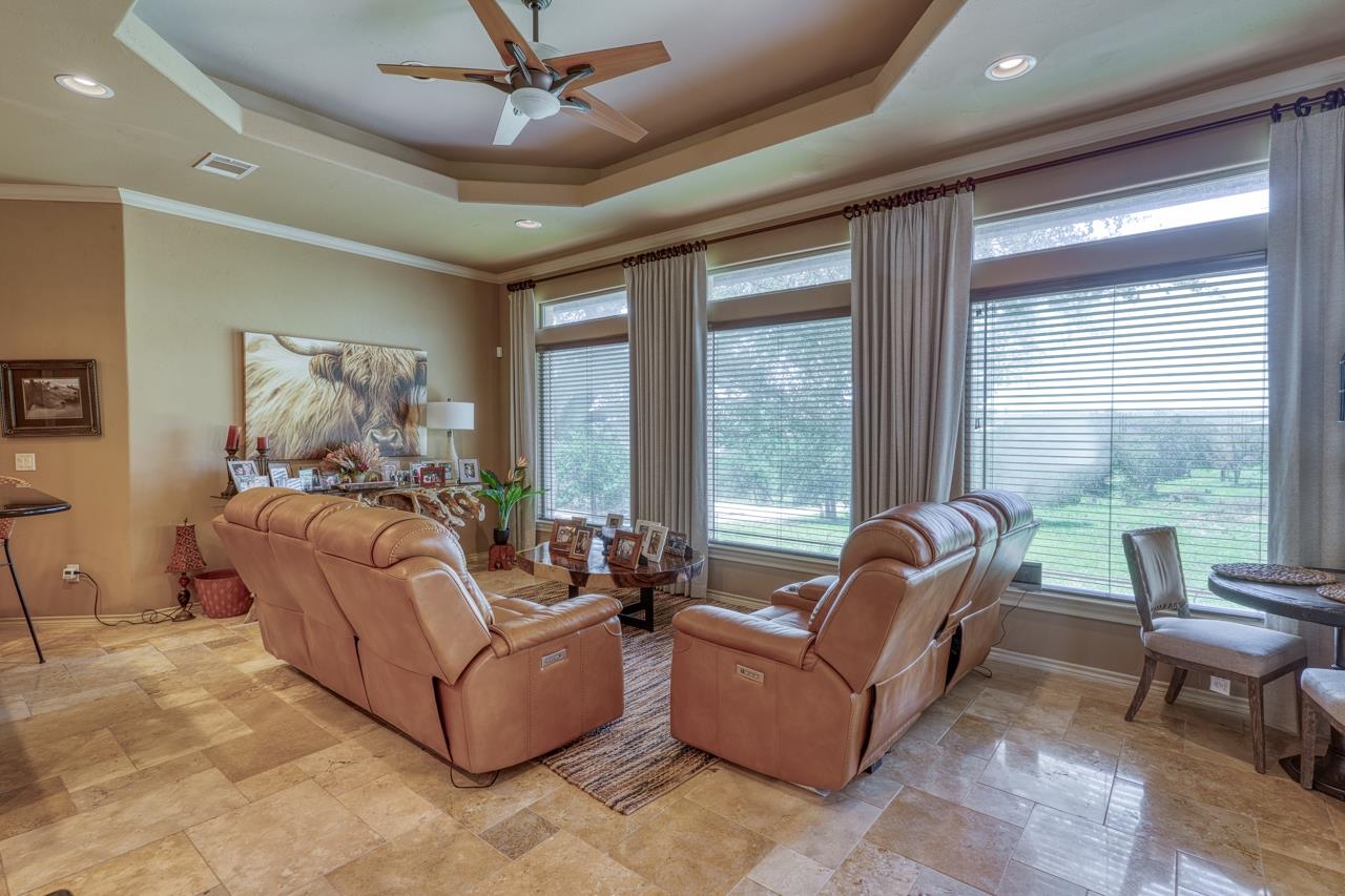 1612 Swear Injun Horseshoe Bay, TX 78657 - Photo 10 of 30 a living room with furniture and a large window