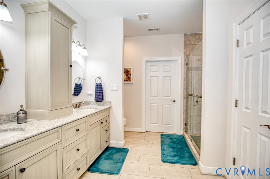 7075 Menzels Road Toano, VA 23168 - Photo 33 of 50 Dual vanity with stone-finish countertop, light-to