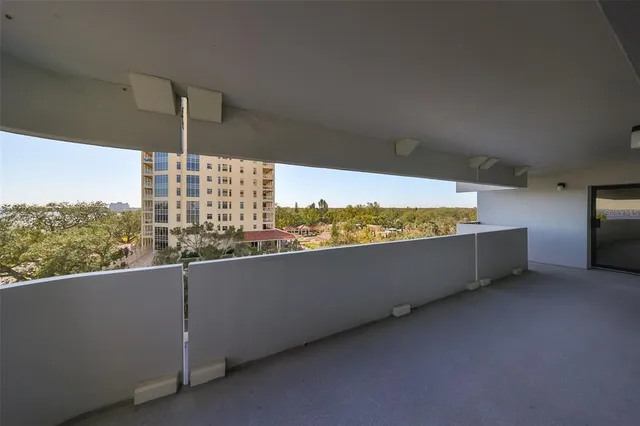 a view of balcony with furniture