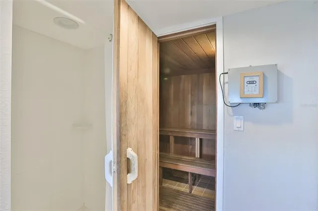 a living room with lots of furniture and a book shelf