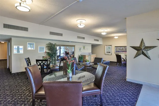 a living room with furniture a rug and a window