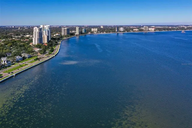 an aerial view of beach and city