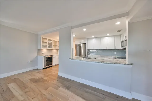 a view of kitchen with wooden floor