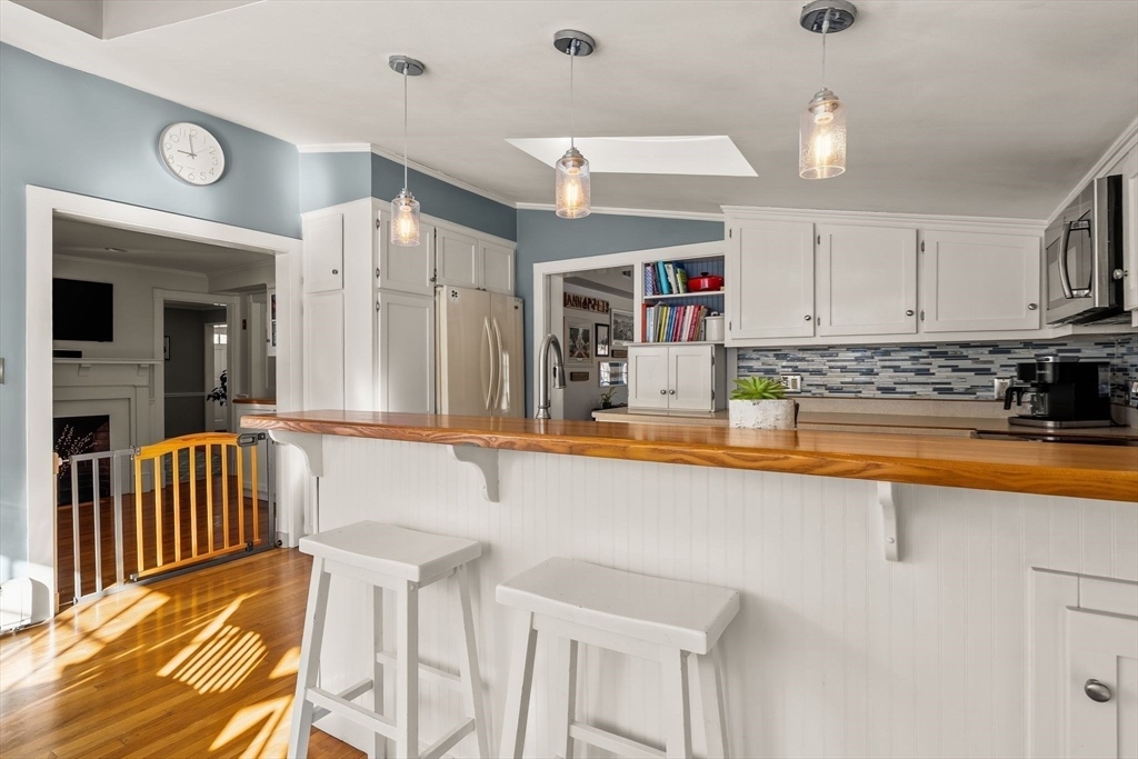 20 Lawson Road Scituate, MA 02066 - Photo 8 of 37 a kitchen with stainless steel appliances granite countertop a sink and a refrigerator