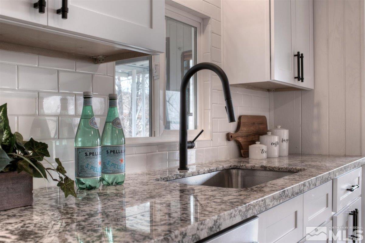 180 Chlorite Court Reno, NV 89521 - Photo 1 of 33 a kitchen with a sink and a window
