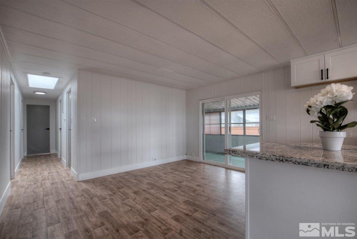 180 Chlorite Court Reno, NV 89521 - Photo 32 of 33 a view of empty room with wooden floor and potted plant