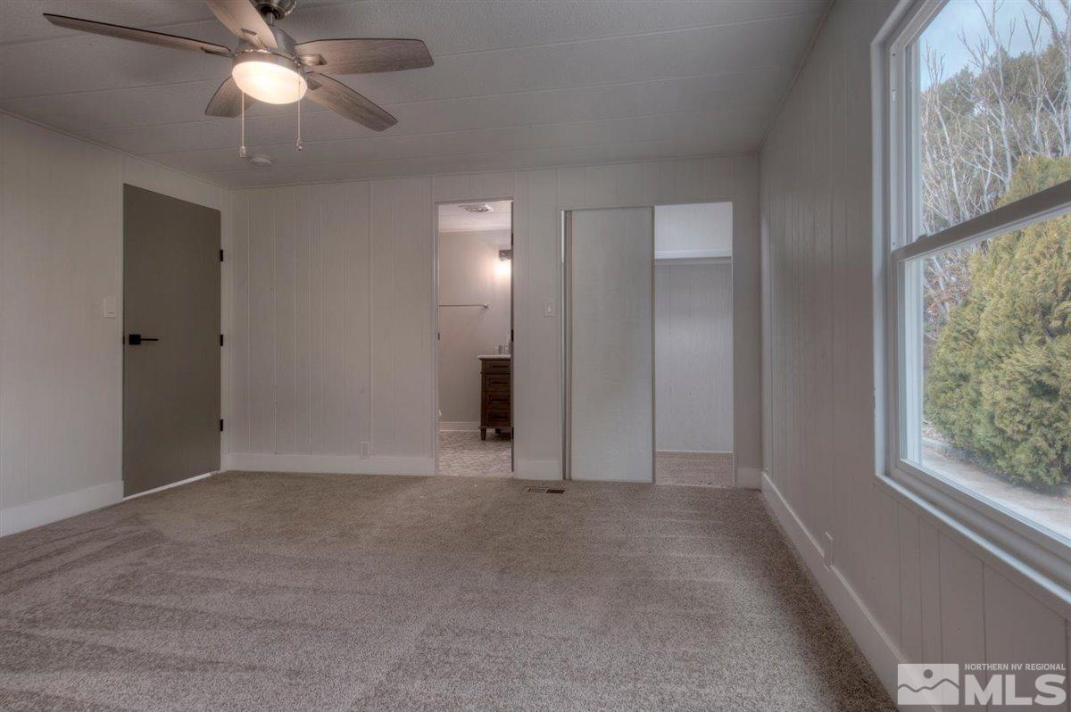 180 Chlorite Court Reno, NV 89521 - Photo 10 of 33 a view of an empty room with a window
