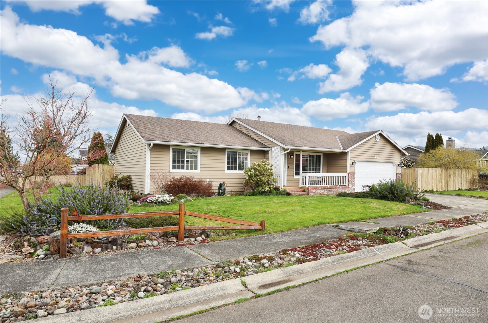 2947 Edel Avenue Enumclaw, WA 98022 - Photo 1 of 35 a front view of a house with a yard and garage