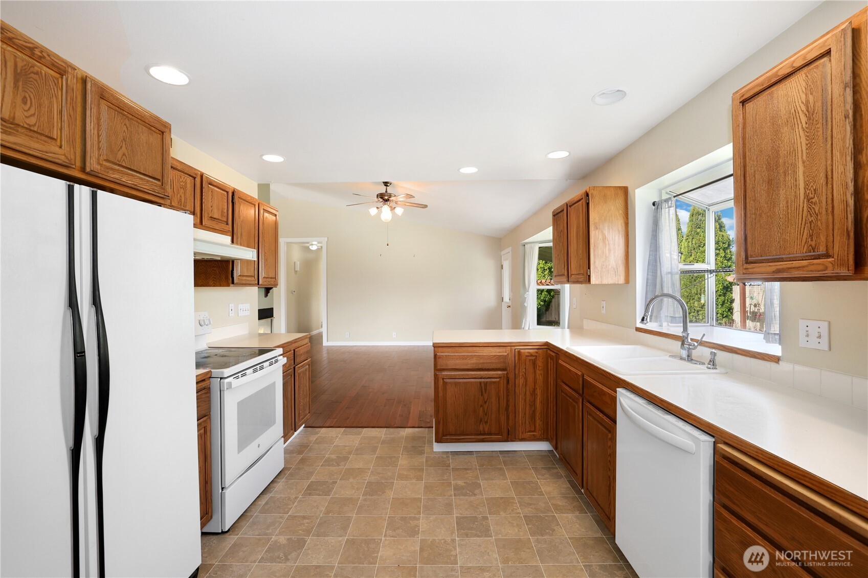 2947 Edel Avenue Enumclaw, WA 98022 - Photo 11 of 35 a kitchen with stainless steel appliances granite countertop a refrigerator and a sink
