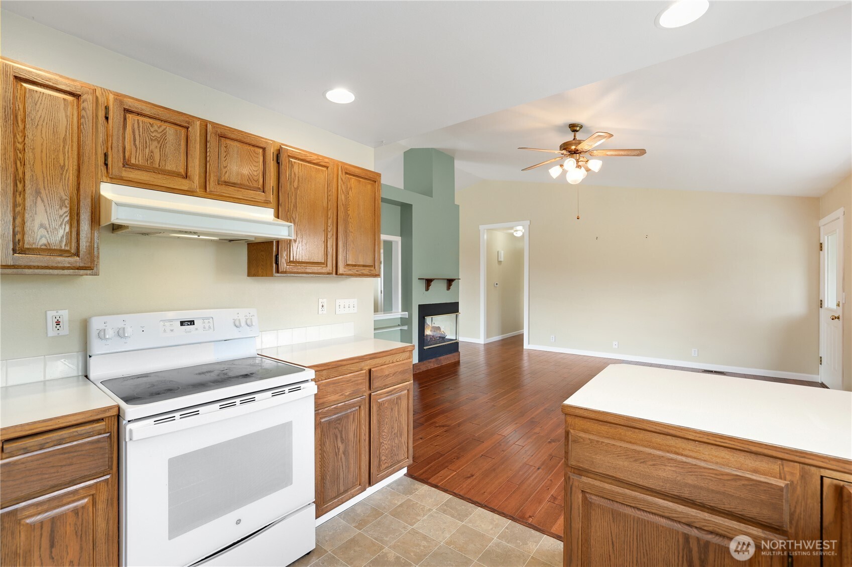 2947 Edel Avenue Enumclaw, WA 98022 - Photo 12 of 35 a kitchen with a stove cabinets and wooden floor