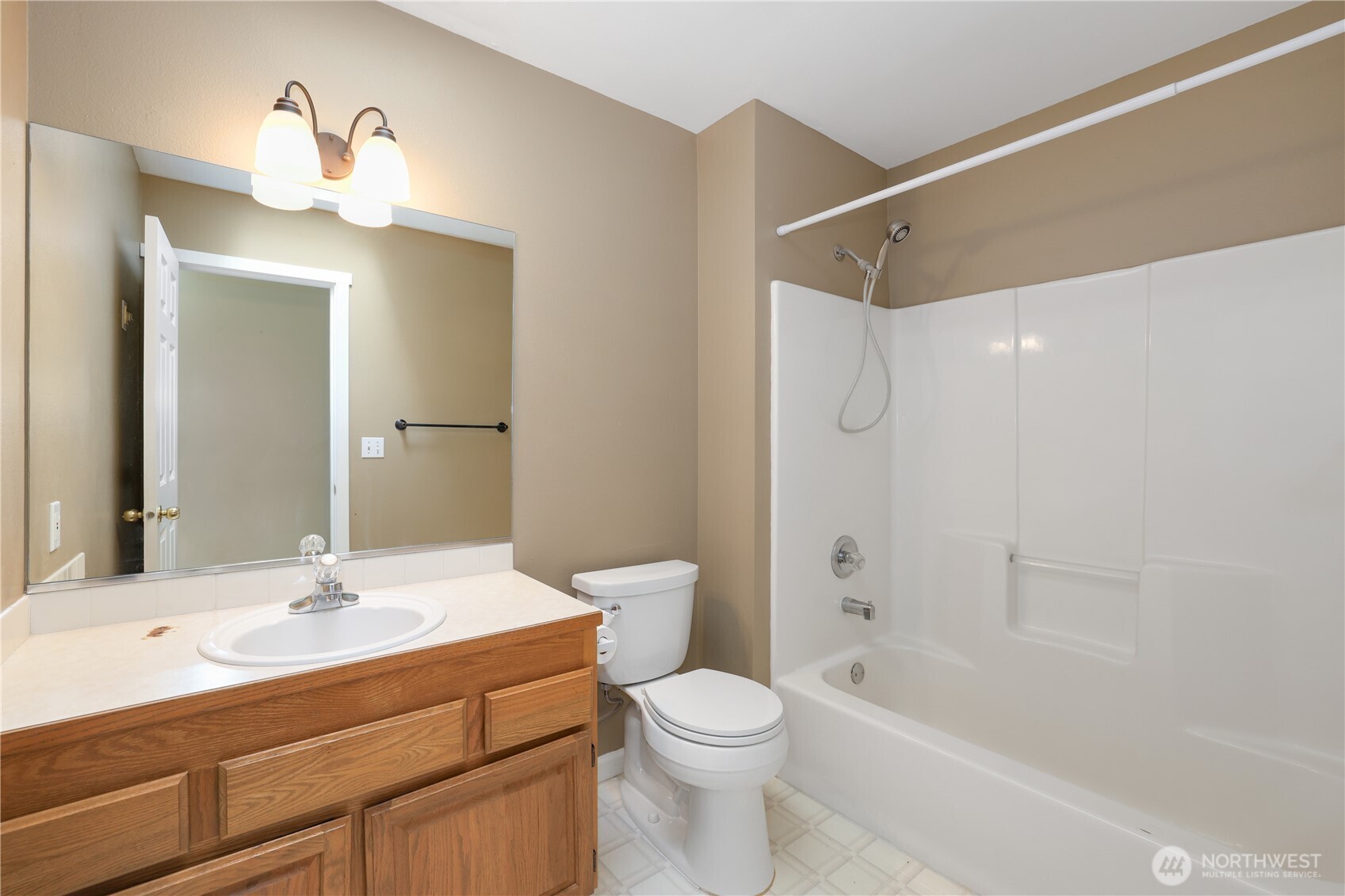 2947 Edel Avenue Enumclaw, WA 98022 - Photo 19 of 35 a bathroom with a sink a toilet and a mirror
