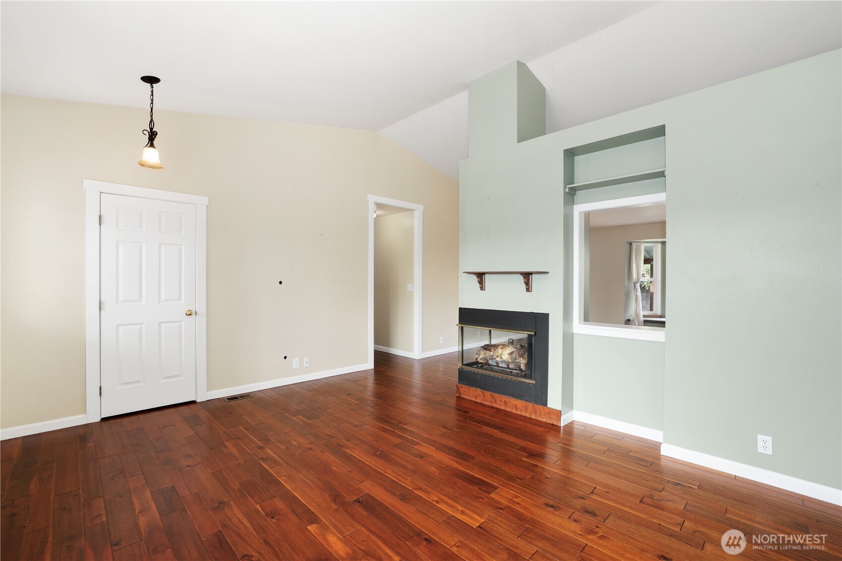 2947 Edel Avenue Enumclaw, WA 98022 - Photo 5 of 35 a view of an empty room with a fireplace and wooden floor