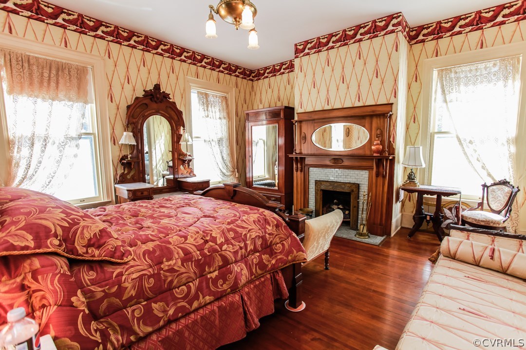 4016 Hermitage Road Richmond, VA 23227 - Photo 11 of 24 a bedroom with a bed and a fireplace