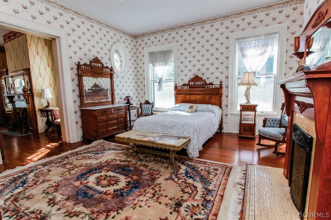 4016 Hermitage Road Richmond, VA 23227 - Photo 13 of 24 a bedroom with a bed and wooden floor