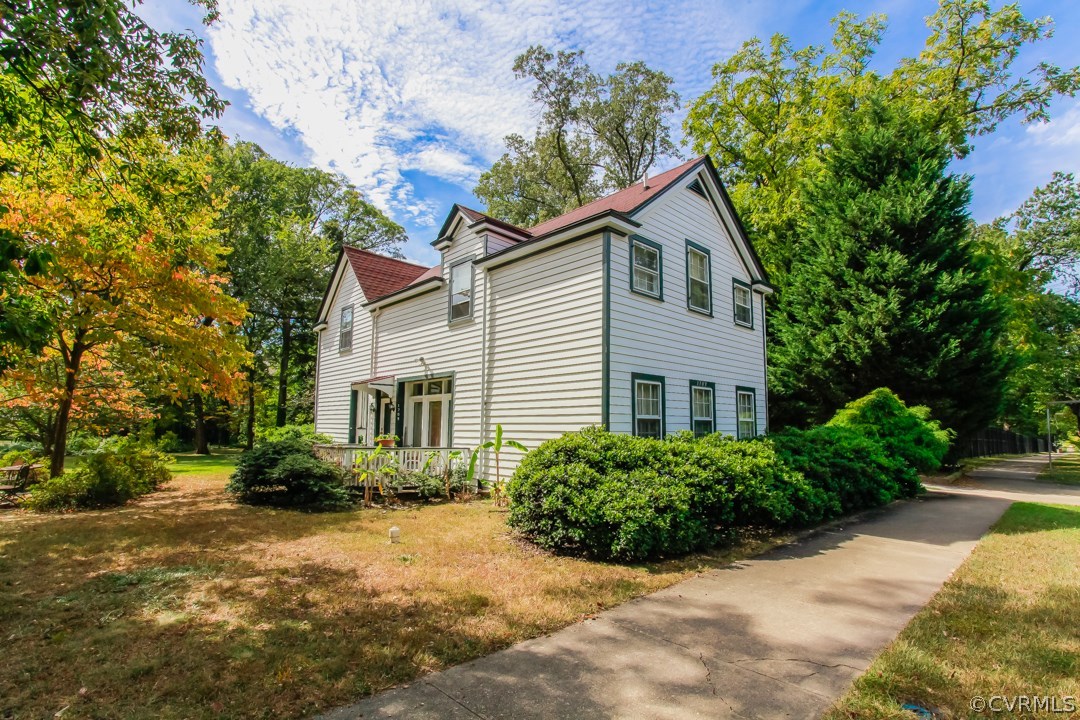 4016 Hermitage Road Richmond, VA 23227 - Photo 20 of 24 a house that has a tree in front of it