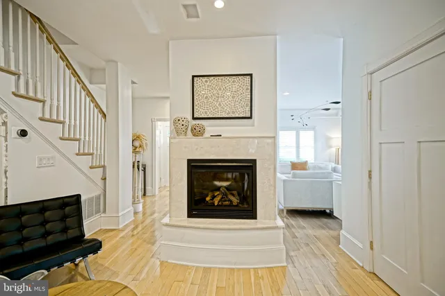 a view of a kitchen with a sink and dishwasher with white walls